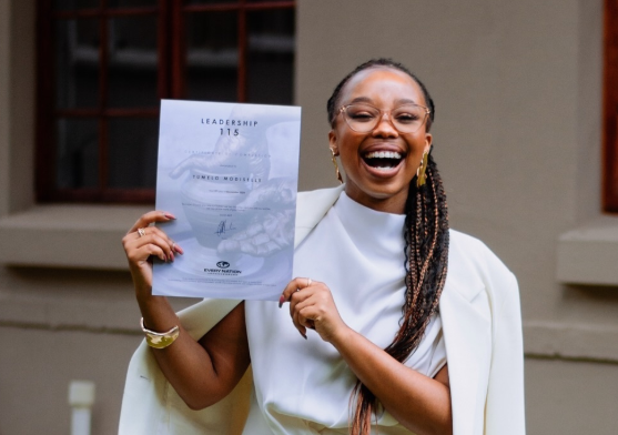 Candice Modiselle holding up a certificate