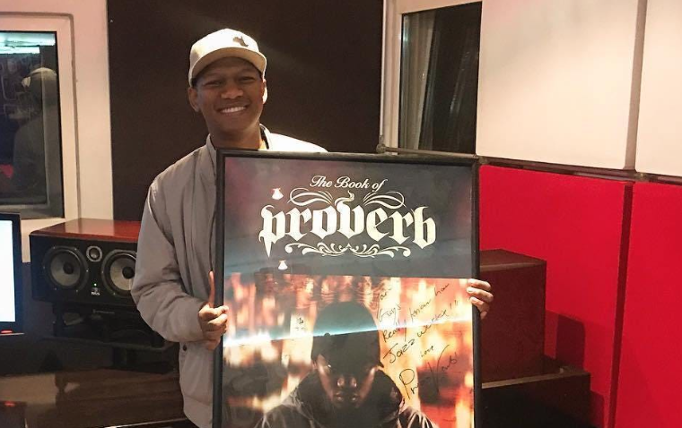 ProVerb holding a music plaque